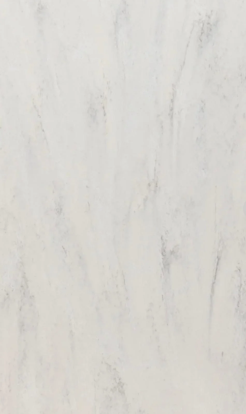Close-up of white marble-look tile or slab with soft gray vertical veining and subtle cloudy texture